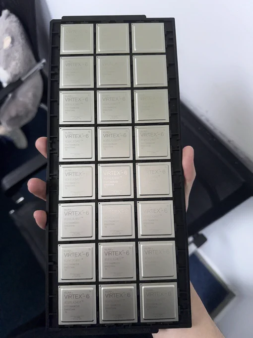 A tray of Xilinx Virtex-6 FPGA packages held for inspection